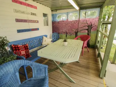 a white table and chairs on a porch at The Pod in Shrewsbury