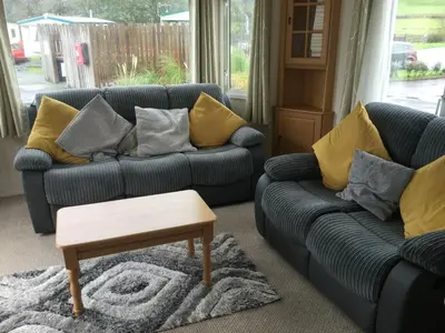 a living room with two couches and a coffee table at H2 in Aberystwyth