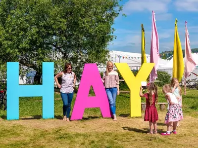 a group of children standing in front of a sign that reads learnvae at 3 Bed in Clyro 88077 in Clyro