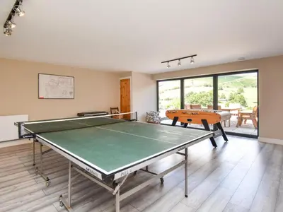 a room with a ping pong table in it at 4 Bed in Oswestry oc-87477 in Llansilin