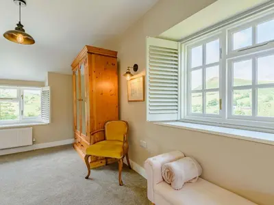 a living room with a couch and a window at 4 Bed in Oswestry oc-87477 in Llansilin
