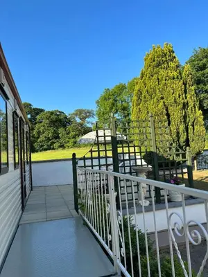 a balcony of a house with a view of a park at Heavenly Retreat in Lampeter