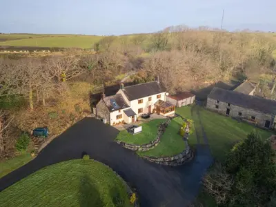 an aerial view of a house with a yard at 5 Bed in Aberystwyth oc-58889 in Llanrhystyd