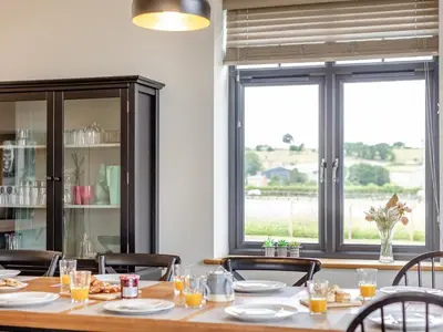 a dining room with a table and chairs and a window at 5 Bed in Llanymynech oc-80686 in Llanymynech