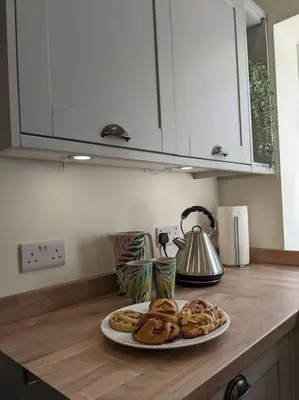 a table with a plate of pastries on a counter at The Barrels at Leintwardine in Leintwardine