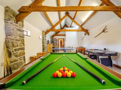 a pool table with balls on it in a room at 1 Bed in Dyffryn Ardudwy oc-89777 in Dyffryn