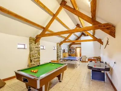 a room with a pool table and two tables at 1 Bed in Dyffryn Ardudwy oc-89777 in Dyffryn
