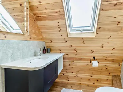 a bathroom with a sink and a wooden wall at 2 Bed in Rhayader oc-90276 in Saint Harmon