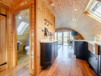 a kitchen with wooden walls and a ceiling with windows at 2 Bed in Rhayader oc-90280 in Saint Harmon