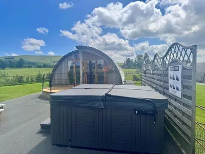 a gazebo with a trash can next to a fence at 2 Bed in Rhayader oc-90280 in Saint Harmon