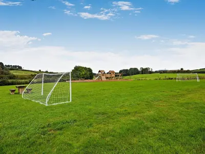 a soccer field with a goal in the grass at 1 Bed in Rhayader oc-90277 in Saint Harmon