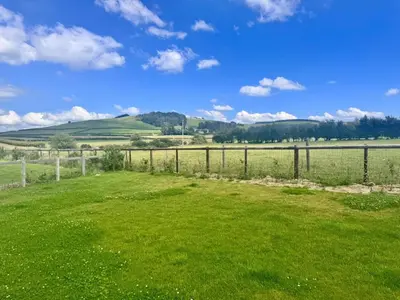 a field of green grass with a fence at 1 Bed in Rhayader oc-90277 in Saint Harmon