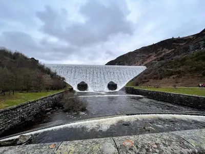 a bridge over a river with a waterfall at 1 Bed in Rhayader oc-90284 in Saint Harmon