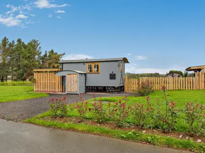 a tiny house in a yard with a garden at 1 Bed in Rhayader oc-90284 in Saint Harmon