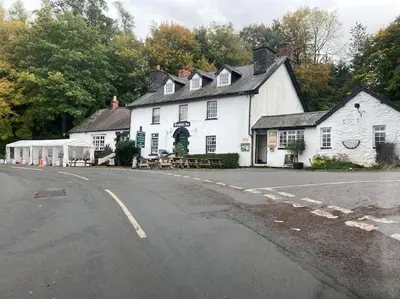 a large white building on the side of a road at Lovely peaceful 2 bed cottage in Llandderfel