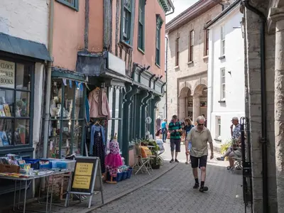 a group of people walking down a street at 4 Bed in Painscastle 90375 in Builth Wells