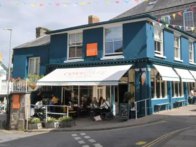 a blue building with people sitting inside of it at 4 Bed in Painscastle 90375 in Builth Wells