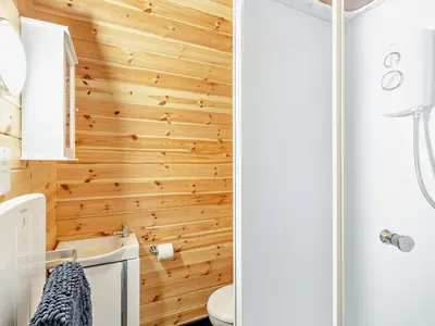 a bathroom with wood paneling and a shower at 1 Bed in Church Stretton oc-90929 in All Stretton