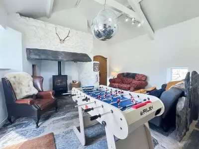 a living room with a giant chess board in the middle of a room at 6 Bed in Harlech oc-91546 in Harlech