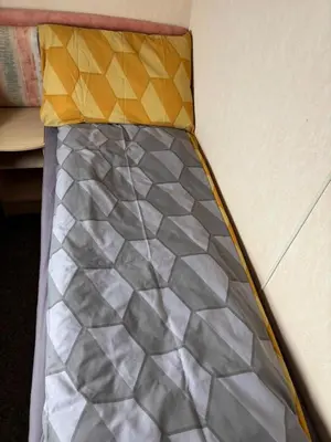 a close up of a bed frame with a mattress sqor at Haven on the Hill 2 Bed Caravan with Town Views of Aberystwyth F7 in Aberystwyth
