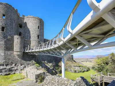 a bridge in front of a castle at Hafod Y Bryn in Harlech