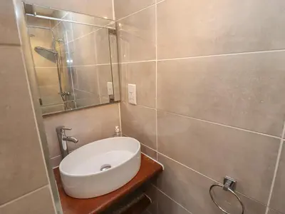 a bathroom with a sink and a mirror at Wayside House in Craven Arms