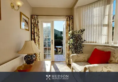 a living room with a couch and a table and a window at Town Centre Period Property by Shrewsbury Abbey in Shrewsbury