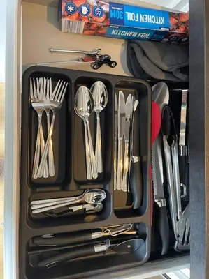 a drawer full of utensils in a refrigerator at The Walkers' Cwtch in Ffestiniog