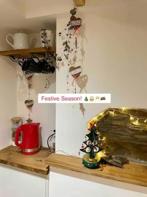 a kitchen counter with a christmas tree on it at The Walkers' Cwtch in Ffestiniog