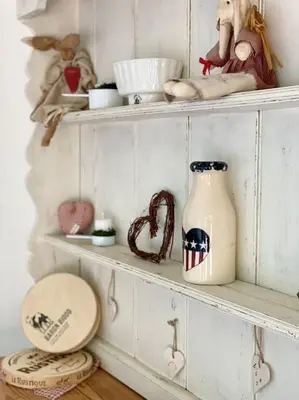a white shelf with a jug and other items on it at Aragon Cottage in Ludlow