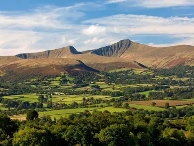 a view of a valley with mountains in the background at 2 Bed in Brecon oc-51153 in Llandefalle