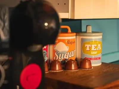 a counter with tea syrup and other products on it at Bunny Lodge 30 - Riverside in Builth Wells