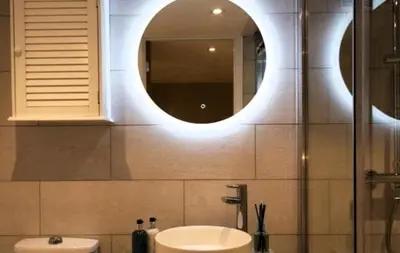 a bathroom with a sink and a mirror at The Cwtch in Ludlow