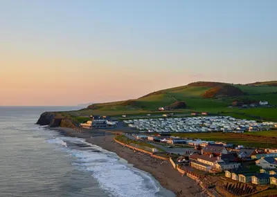 an aerial view of a town next to the ocean at Aber Bay Holiday Park in Aberystwyth