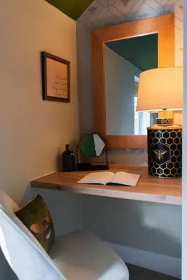 a desk in a room with a lamp and a mirror at The Hive, Central Ludlow, Free Parking, Boutique Hotel Style in Ludlow