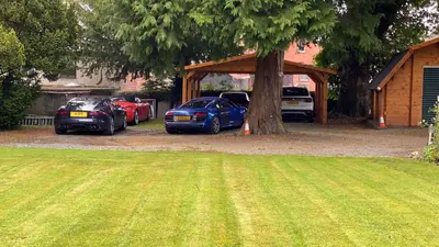 a group of cars parked next to a tree at Penralley House B&B in Rhayader