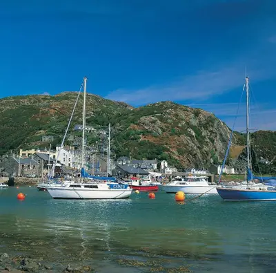 a group of boats sitting in the water at Penbryn Mynach Holiday Cottage in Barmouth