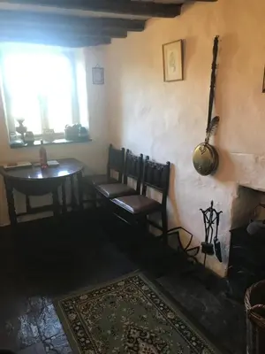 a room with two chairs and a table and a window at Tanybryn (Welsh meaning on the brow of a hill) in Tregaron