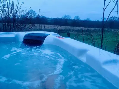 a jacuzzi tub with a car in it at Tanybryn (Welsh meaning on the brow of a hill) in Tregaron