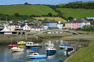 a group of boats in a river in a town at Swn y Mor Aberaeron in Aberaeron