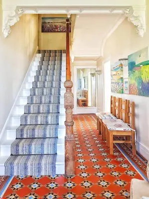 a staircase in a house with a stair case at Y Garth, Sleeps 12 in Barmouth