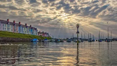 a view of a harbor with boats in the water at Brynonnen Llangrannog in Llanllwchaiarn