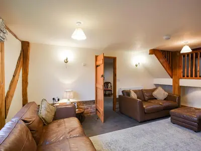 a living room with a couch and a table at Uk46578 - Drifthouse in Church Stretton