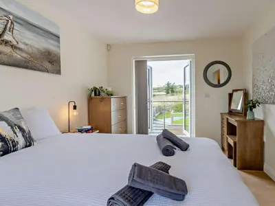 a bedroom with a white bed with towels on it at 4 Bed in Bishops Castle 94072 in Bishops Castle