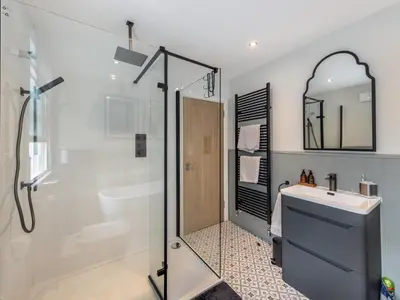a bathroom with a shower and a sink at 4 Bed in Aberdovey 94232 in Aberdyfi