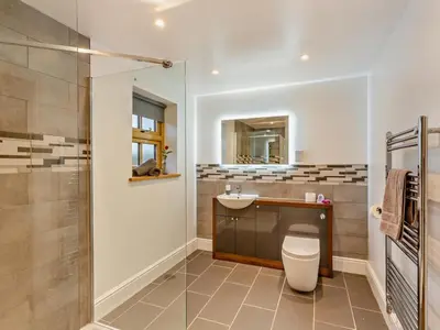 a bathroom with a toilet and a sink and a shower at 2 Bed in Craven Arms oc-94099 in Clun