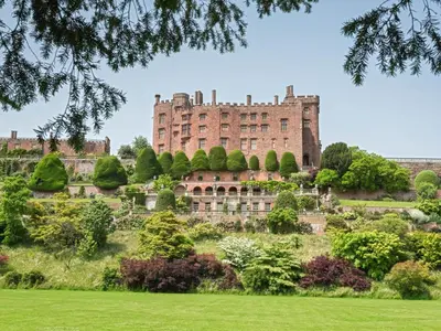 an old castle on a hill with a garden at 2 Bed in Craven Arms oc-94099 in Clun