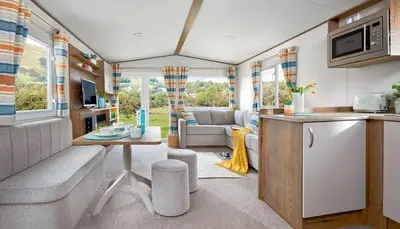 a kitchen and living room in a caravan at WH - Smugglers Cove 03 in Aberaeron