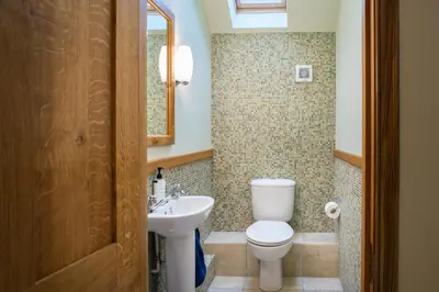a bathroom with a toilet and a sink at Ty Cellin Tregaron in Ystrad-Meurig
