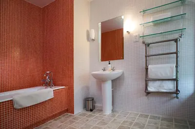 a bathroom with a sink and a mirror at Bryn Isaf Tregaron in Ystrad-Meurig